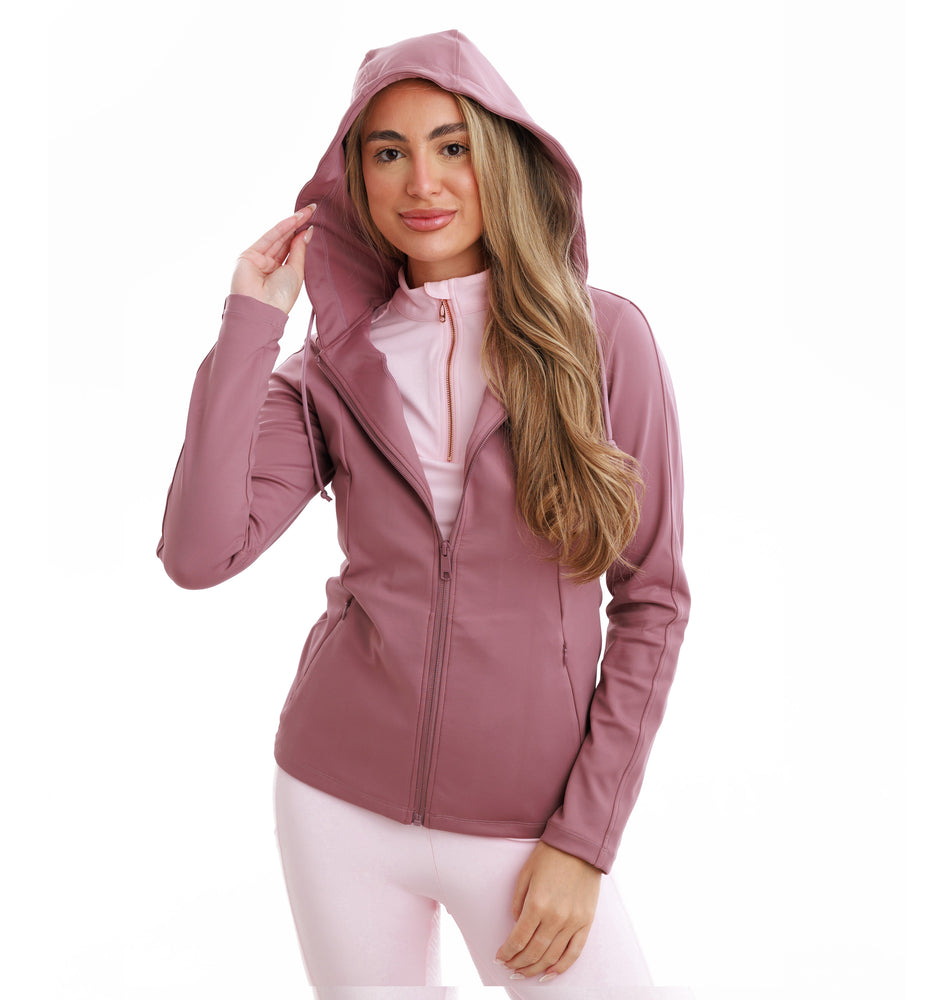 
                  
                    Woman wearing a pink hooded jacket on a white background
                  
                