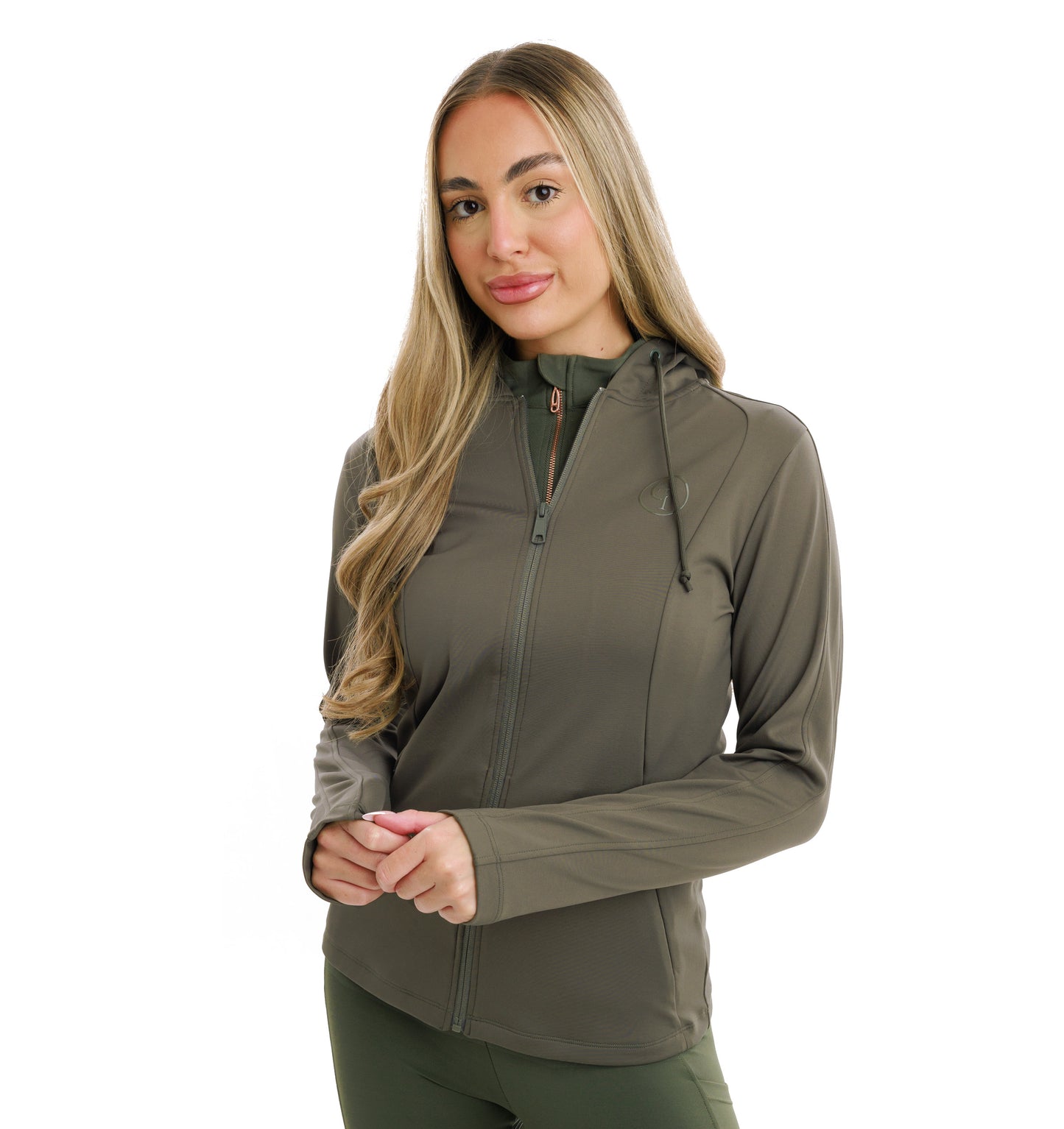 
                  
                    Woman wearing a dark green jacket zipped up over an olive green fleece on a white background
                  
                